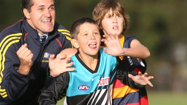 Former PHOS Camden junior and current Port Adelaide defender Ryan Burton wearing Power gear at age nine. Picture: File