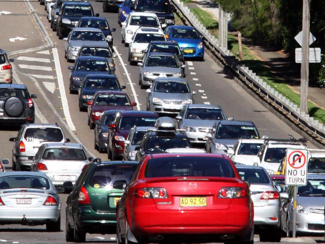 A long line of cars caught in a traffic jam along the Pacific Highway at Wahroonga waiting to get onto the F3 motoway.