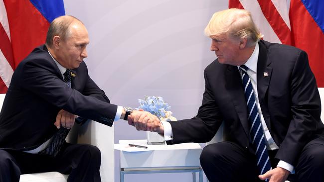 Vladimir Putin and Donald Trump Putin shake hands during a meeting on the sidelines of the G20 Summit in Hamburg, Germany. Picture: AFP/Saul Loeb