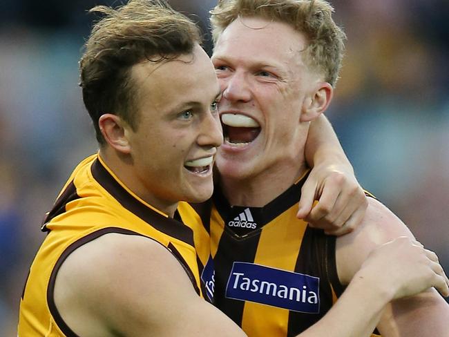 Hawthorn vs Collingwood at the MCG. Billy Hartung celebrates a last qtr goal with James Sicily . Pic: Michael Klein