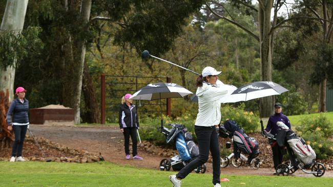 Amira Sharman tees off on the 10th hole at Box Hill Golf Course. Picture: Hamish Blair