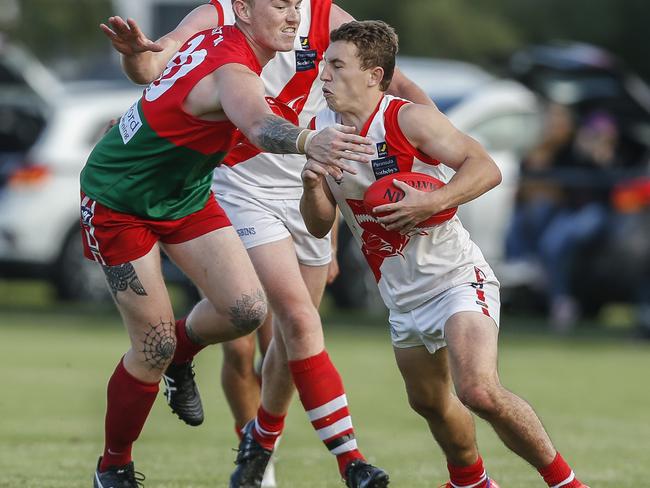 Sorrento’s Shannon Gladman tries to evade Pines big man Jake Pusch. Picture: Valeriu Campan