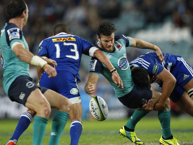 Waratahs winger Rob Horne is belted in a Stormers tackle.