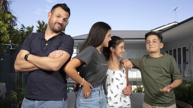 Brighton Teenage sisters Simone, 15, and Zara, 13, with their friend Jack, 11, and Jack’s very confused father John. Picture: AAP/Emma Brasier