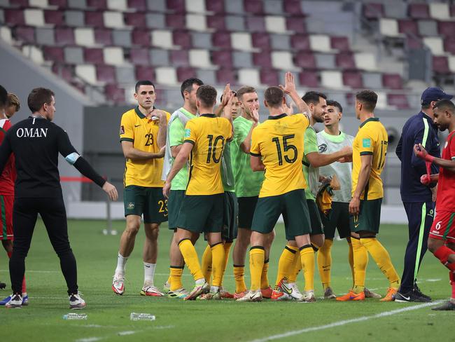 The Socceroos celebrate their win over Oman. Picture: Karim Jaafar/AFP