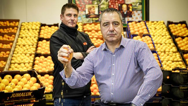 Angelo Demasi, chief executive of the Produce Markets at Pooraka, with citrus specialist Pete Mercurio of Bache Bros, know the potentially dire consequences of an uncontrolled fruit fly outbreak. Picture: Mike Burton