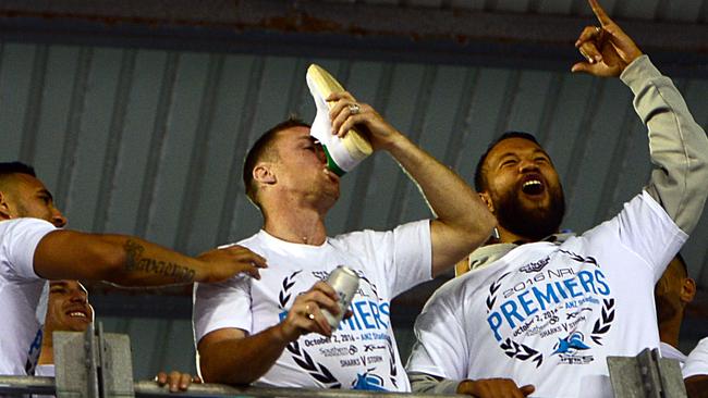 Victory never tasted so sweaty... James Maloney drinks from sneaker. Picture: Jeremy Piper