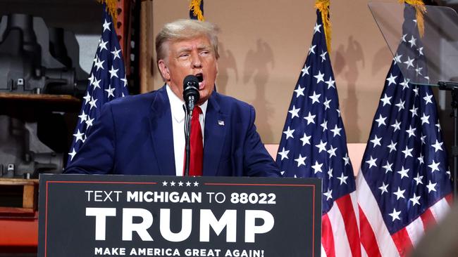 Donald Trump speaks to workers at the non-unionised automotive parts manufacturer Drake Enterprises in Clinton Township, Michigan, on Wednesday. Picture: AFP