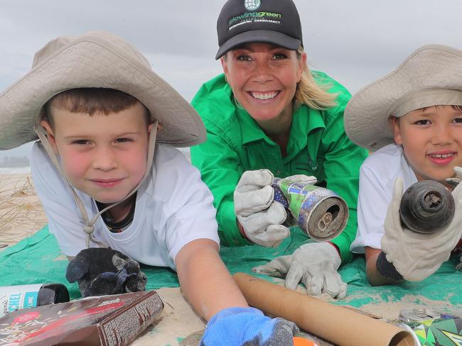 Project 2020 is a new beachcare program going into schools and early childhood centres.Director Larissa and children from Currumbin State school sort through rubbish found on the beach. Picture Glenn Hampson