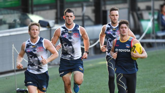 Injured Crows Rory Sloane, Taylor Walker, Brodie Smith and Riley Knight of the Crows at training last week. Picture: AAP Image/David Mariuz