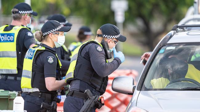 Police at the Lincoln Causeway between Albury and Wodonga. Picture: Simon Dallinger