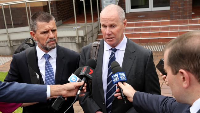 Then Channel 9 news chief Darren Wick (centre) with his lawyer (left) leaving Hornsby local court, where Wick was charged over high-range drink driving. Picture: Damian Shaw