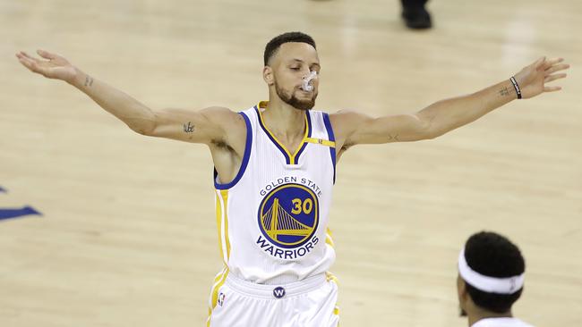 Warriors guard Steph Curry plays up to the crowd. Picture: AP