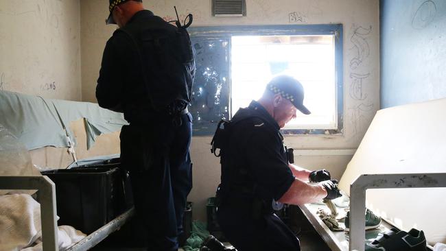 Corrective Services officers raid cells at Silverwater Jail looking for contraband. Picture: Richard Dobson