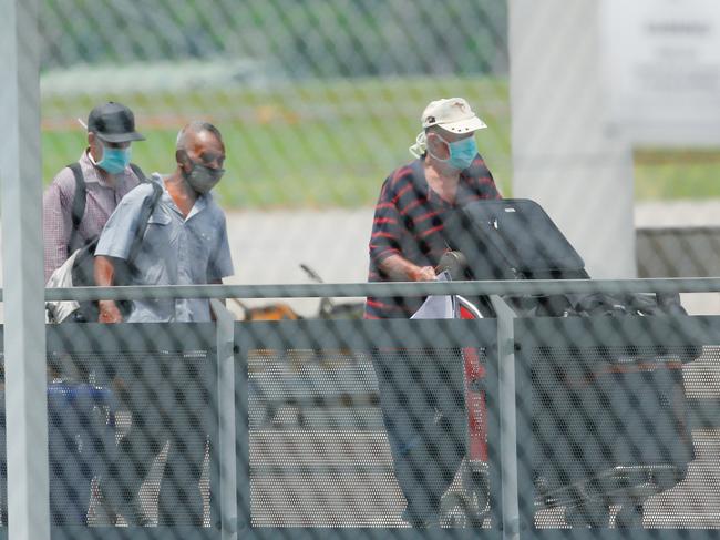 Passengers were escorted by bus to the hotel they’ll be quarantining in after arriving into Darwin from Dili. Picture: GLENN CAMPBELL