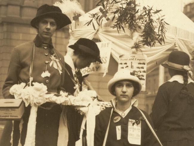 History Olive Bridgwater and her sister Doris outside the Department of Lands building in Bridge Street in Sydney during World War 1, fundraising for Australia Day, 30 July 1915