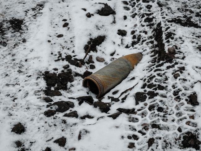 A rusted ordnance lays on the snow-covered ground in Bakhmut on February 1, 2023, amid the Russian invasion of Ukraine. Picture: AFP