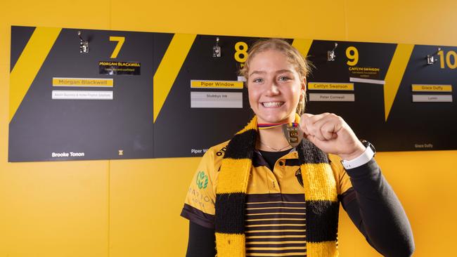 Glenelg's Piper Window with her Best and Fairest medal. Picture: Ben Clark