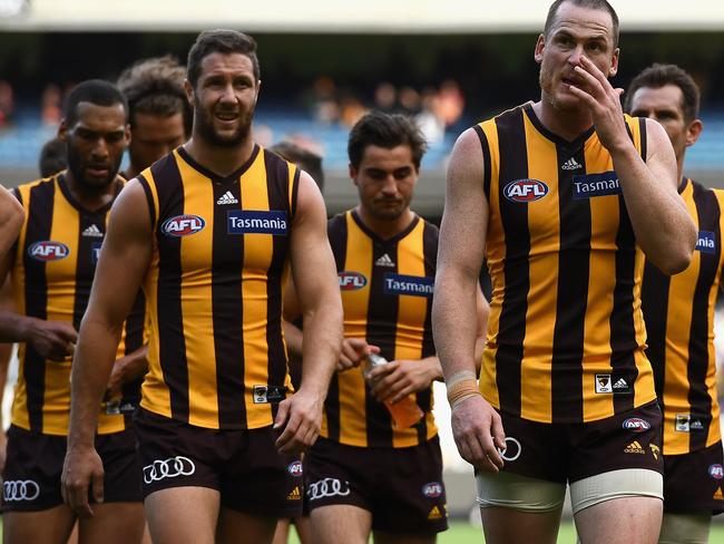 The Hawks look dejected after losing the round two match against Crows