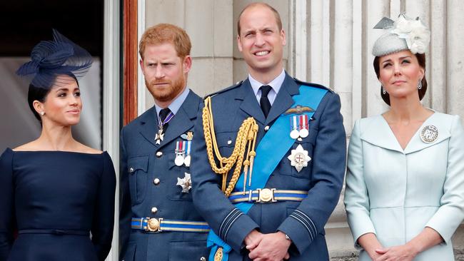 Meghan, Harry, William and Catherine watch a fly-past to mark the centenary of the Royal Air Force from the balcony of Buckingham Palace in 2018. Picture: Getty Images.