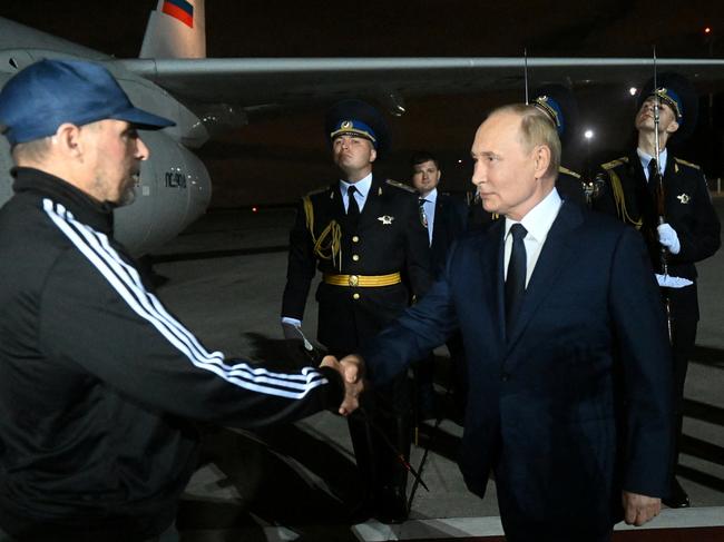 Russia's President Vladimir Putin greets Russian national Vadim Krasikov, who was released in a prisoner exchange between Russia with Western countries, during a welcoming ceremony at Vnukovo International Airport in Moscow, Russia August 1, 2024. Sputnik/Mikhail Voskresensky/Pool via REUTERS ATTENTION EDITORS - THIS IMAGE WAS PROVIDED BY A THIRD PARTY.