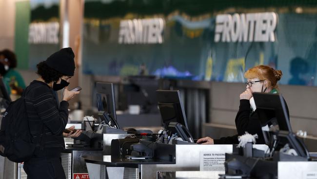 A passenger checks in with Frontier Airlines at Denver International Airport. Picture: AP