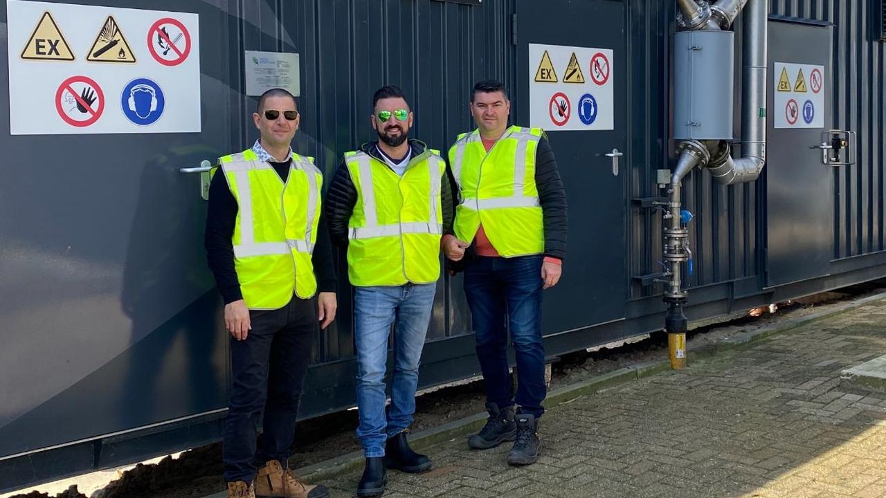 Developers Franco Lepore, Frank Vounasis and Daniel Palumbo inspecting a bioreactor in the Netherlands.