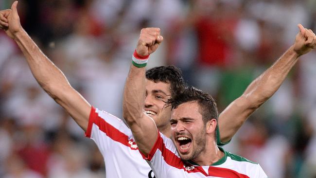 BRISBANE, AUSTRALIA - JANUARY 19: Soroush Rafiei and Morteza Pouraliganji of Iran celebrate their teams victory after the 2015 Asian Cup match between IR Iran and the UAE at Suncorp Stadium on January 19, 2015 in Brisbane, Australia. (Photo by Bradley Kanaris/Getty Images)