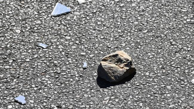 Rocks and glass scatter George St, Thebarton. Picture: Brenton Edwards