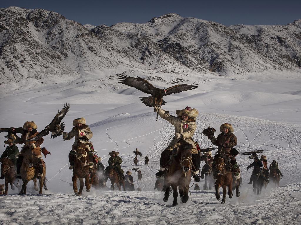 “The Eagle Hunting festival is part of an effort to promote and grow traditional hunting practices for new generations in the mountainous region of western China that borders Kazakhstan, Russia and Mongolia.” Picture: Kevin Frayer, Canada, Shortlist, Professional Environment, 2016 Sony World Photography Awards