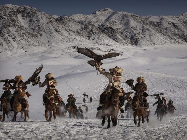 “The Eagle Hunting festival is part of an effort to promote and grow traditional hunting practices for new generations in the mountainous region of western China that borders Kazakhstan, Russia and Mongolia.” Picture: Kevin Frayer, Canada, Shortlist, Professional Environment, 2016 Sony World Photography Awards