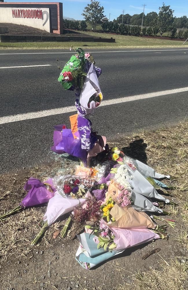 Flowers at the site of the crash that killed three women.