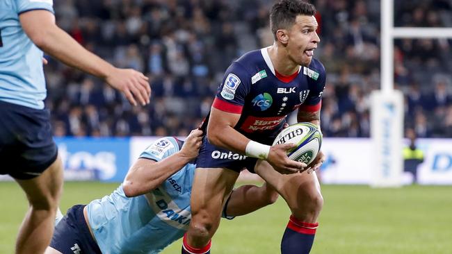 SYDNEY, AUSTRALIA - APRIL 24: Matt Toomua of the Rebels is tackled during the round 10 Super RugbyAU match between the NSW Waratahs and the Melbourne Rebels at Bankwest Stadium, on April 24, 2021, in Sydney, Australia. (Photo by David Neilson/Getty Images)