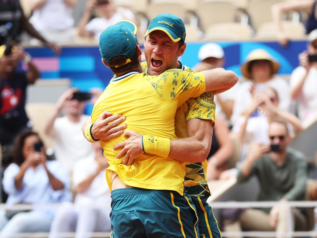 PARIS, FRANCE - AUGUST 03: Matthew Ebden and John Peers of Team Australia celebrate match point during the Tennis Men's Doubles Gold Medal match against Austin Krajicek and Rajeev Ram of Team United States on day eight of the Olympic Games Paris 2024 at Roland Garros on August 03, 2024 in Paris, France. (Photo by Matthew Stockman/Getty Images)