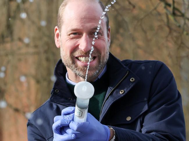 GUILDFORD, ENGLAND - JANUARY 29: William, Prince of Wales has fun with local school children as they filter DNA samples through a syringe after extracting water from a local pond in order to see what species live in it on January 29, 2025 in Guildford, England. The Prince was visiting the 2024 Earthshot Prize Finalist, NatureMetrics, a UK based nature company based in Guildford which enables companies to measure and report on their impact on nature and ecosystems. (Photo by Richard Pohle - WPA Pool/Getty Images)