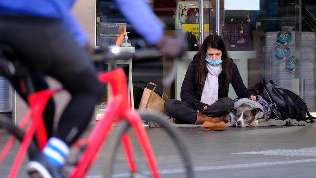 A homeless person and their dog during Melbourne’s fifth lockdown. Picture: NCA NewsWire/Luis Ascui