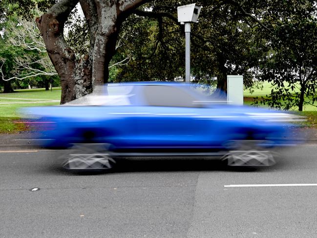 SYDNEY, AUSTRALIA - NewsWire Photos NOVEMBER 30, 2021: Motorists drive past a fixed speed camera as concerns the NSW government's decision to remove warning signs from mobile speed cameras  was a revenue raising exercise.Picture: NCA NewsWire / Jeremy Piper