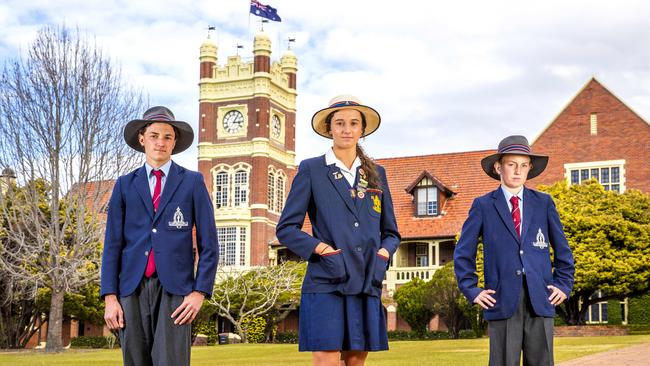 Rose Mayne from St Hilda's Southport (centre) with brothers William (age 16) and Lachlan (age 14) from The Southport School, are among the boarding students who thought they wouldn’t be able to see their families and return to class. Picture: Richard Walker