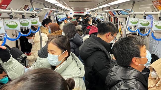 Commuters ride a subway train during the morning rush hour amid the coronavirus outbreak, in Beijing. Picture: Reuters