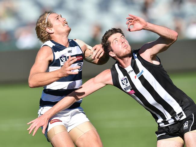 Former Collingwood rookie Darren Wyatt, battling it out here with Geelong’s Tom Stewart, has become a Bull.