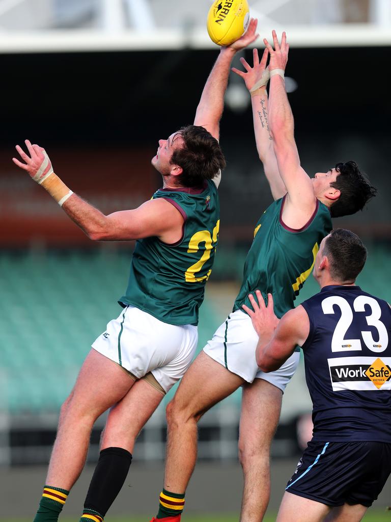 Tasmania Alexander Lee attempts to mark during the game against Vic Metro at UTAS Stadium. PICTURE CHRIS KIDD