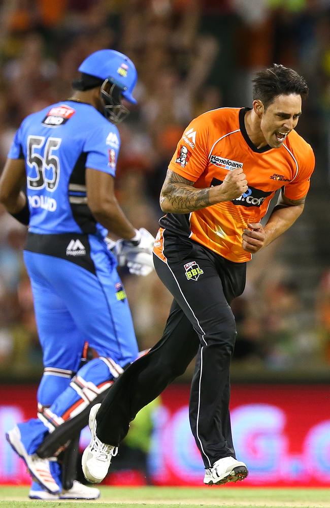 Mitchell Johnson celebrates the wicket of Kieron Pollard.