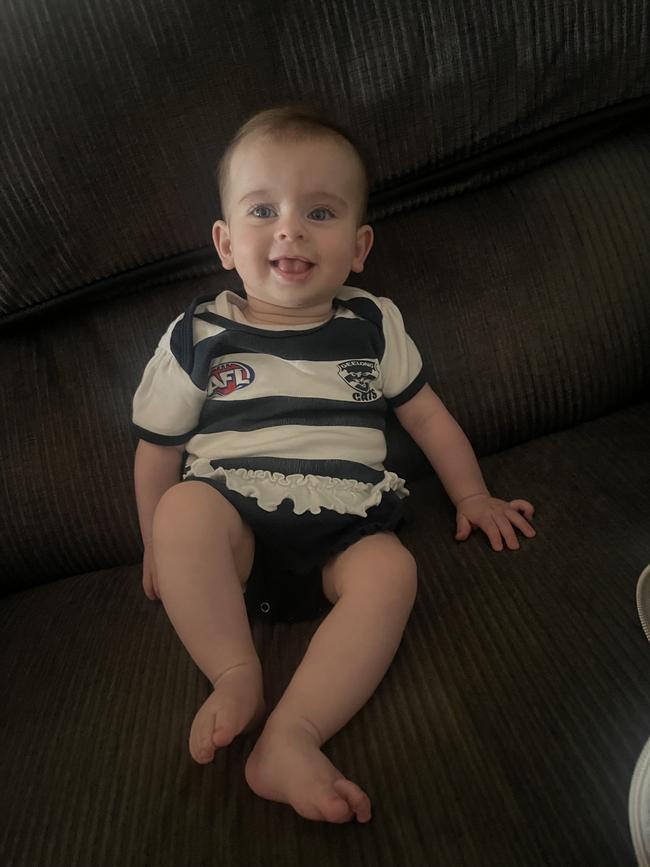 Saylor Lewis, six months old. Saylor is our gorgeous little lady who loves to go on adventures, eat lots of food, hang out with her sister and cheer on the Cats.
