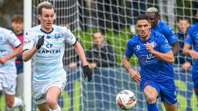 South Melbourne's Max Mikola and Stefan Zinni of Avondale race for the ball. Picture: Mark Avellino