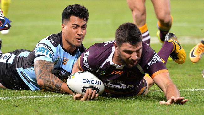 Matt Gillett scores a try for the Broncos.