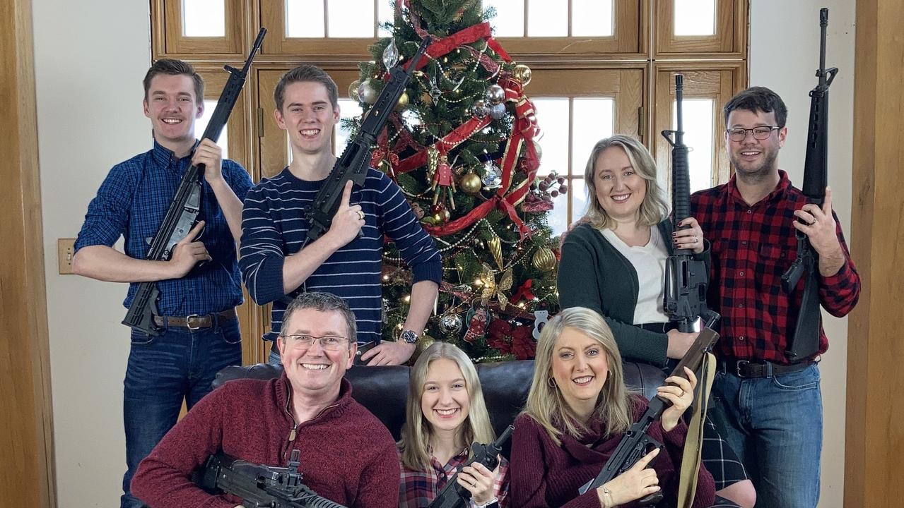 An American politician has been blasted after posting a Christmas card style with his heavily armed family just days after four teenagers were killed in a school shooting.