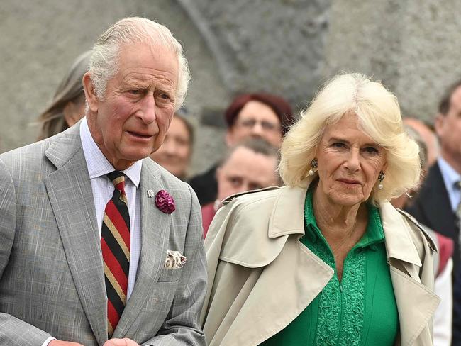 Britain's King Charles III and Britain's Queen Camilla react during a visit to Enniskillen Castle, on May 25, 2023 as part of a two-day visit to Northern Ireland. (Photo by Oliver McVeigh / POOL / AFP)