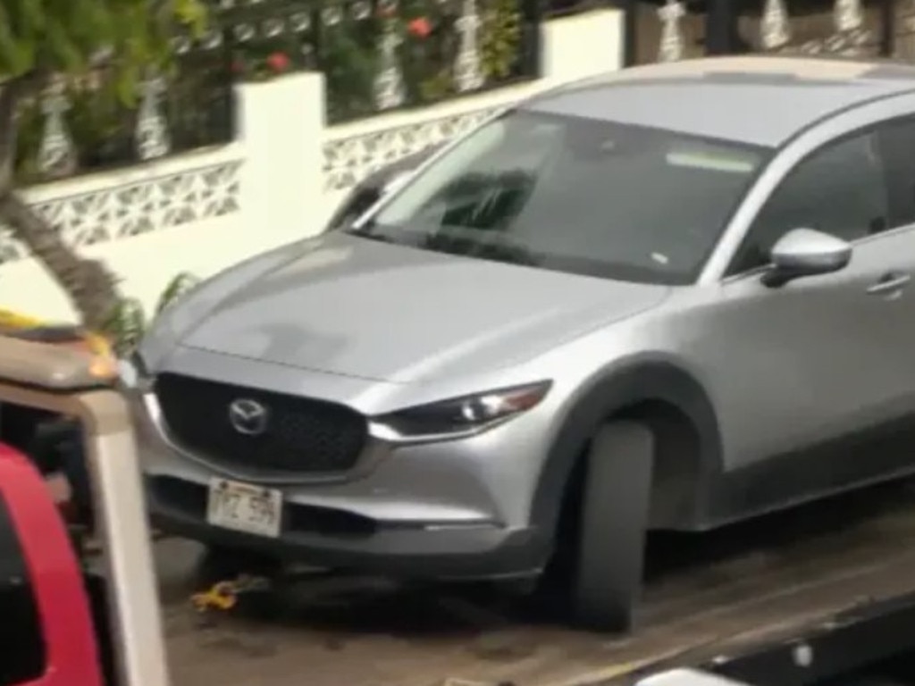 Jason Cachuela's car getting towed away after the murder-suicide. Picture: KITV