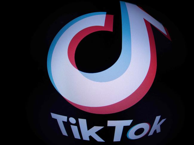 This photograph taken with a fish-eye lens in Paris on March 1, 2023 shows the social media application logo TikTok. - The European Parliament has told staff on March 1, 2023 to purge TikTok from devices used for work because of data protection concerns, after similar moves by the EU's main governing bodies last week. (Photo by JOEL SAGET / AFP)