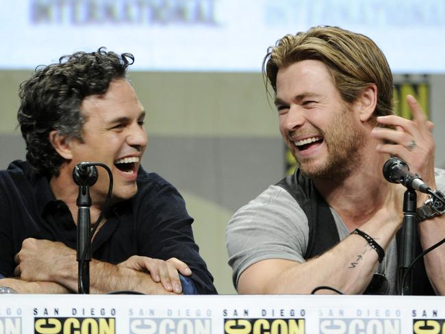 Actors Mark Ruffalo, left, and Chris Hemsworth laugh during the Marvel panel at Comic-Con International. Picture: AP